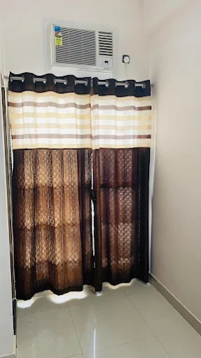 AC and curtains in room